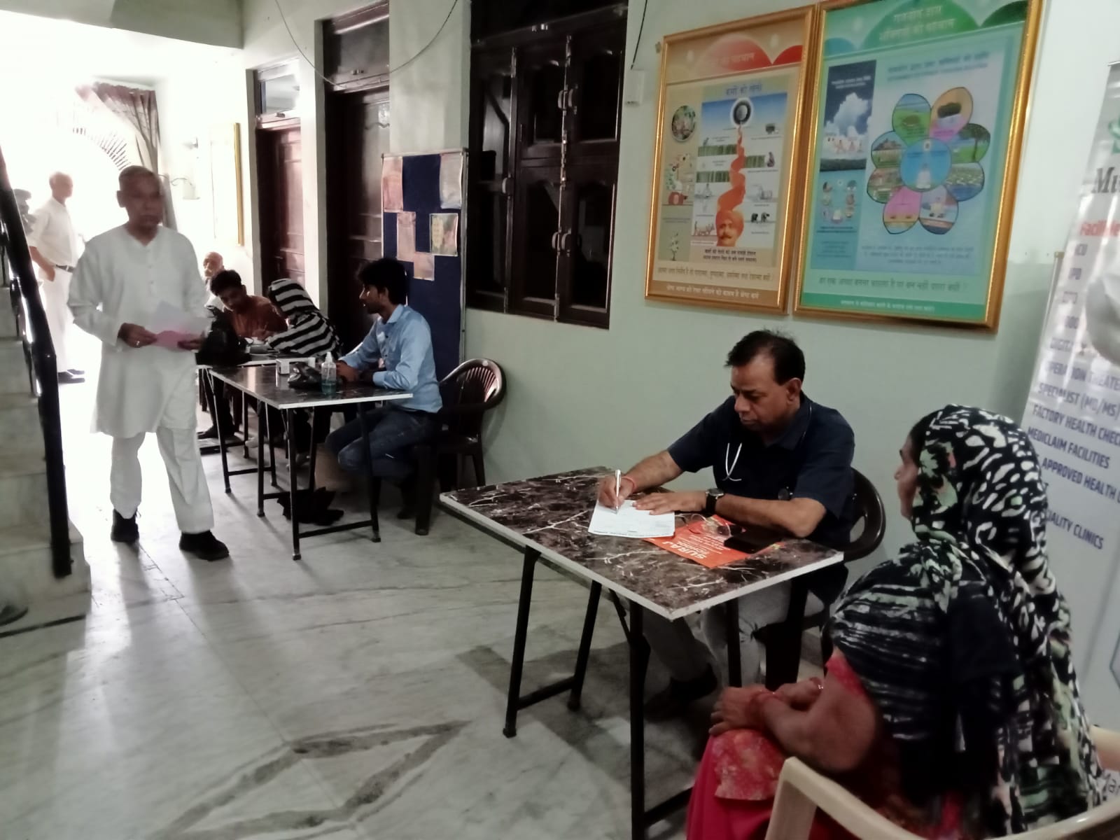 Consultations under way in a community hall
