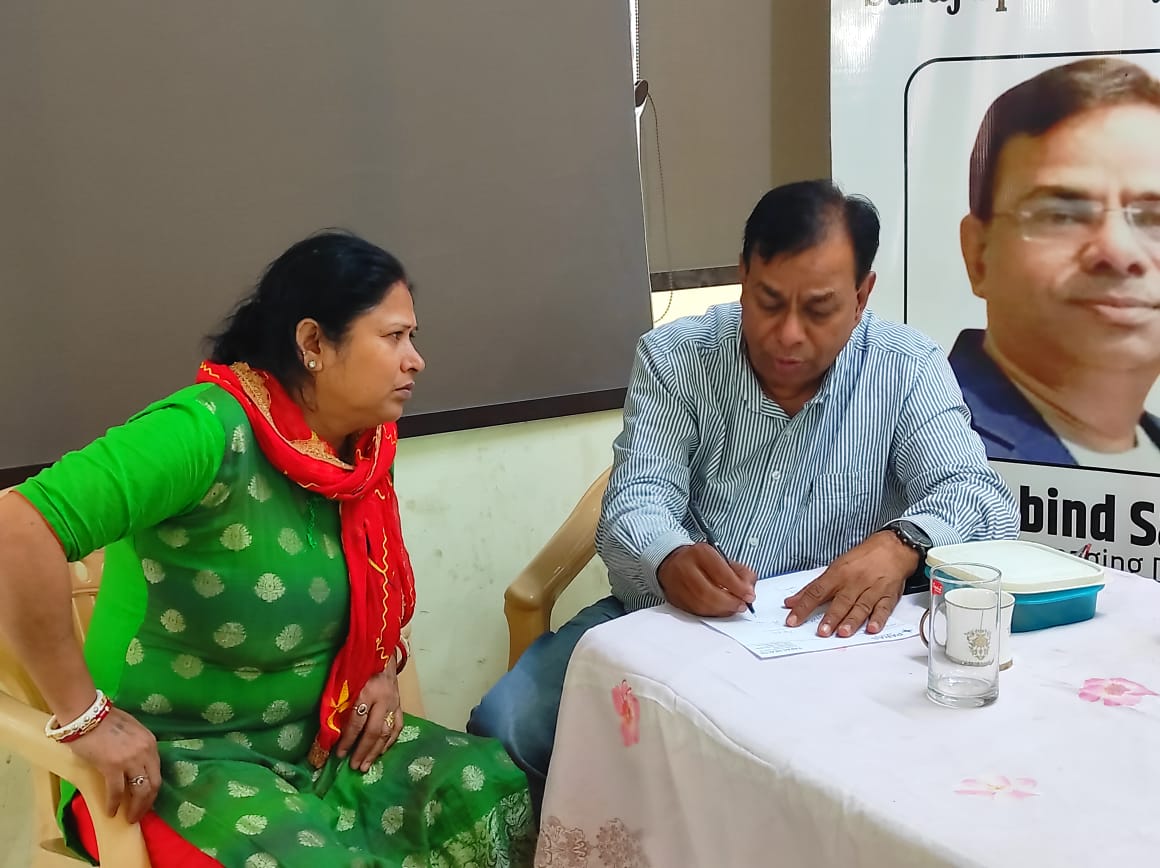A woman being consulted by a doctor at a Foundation health camp