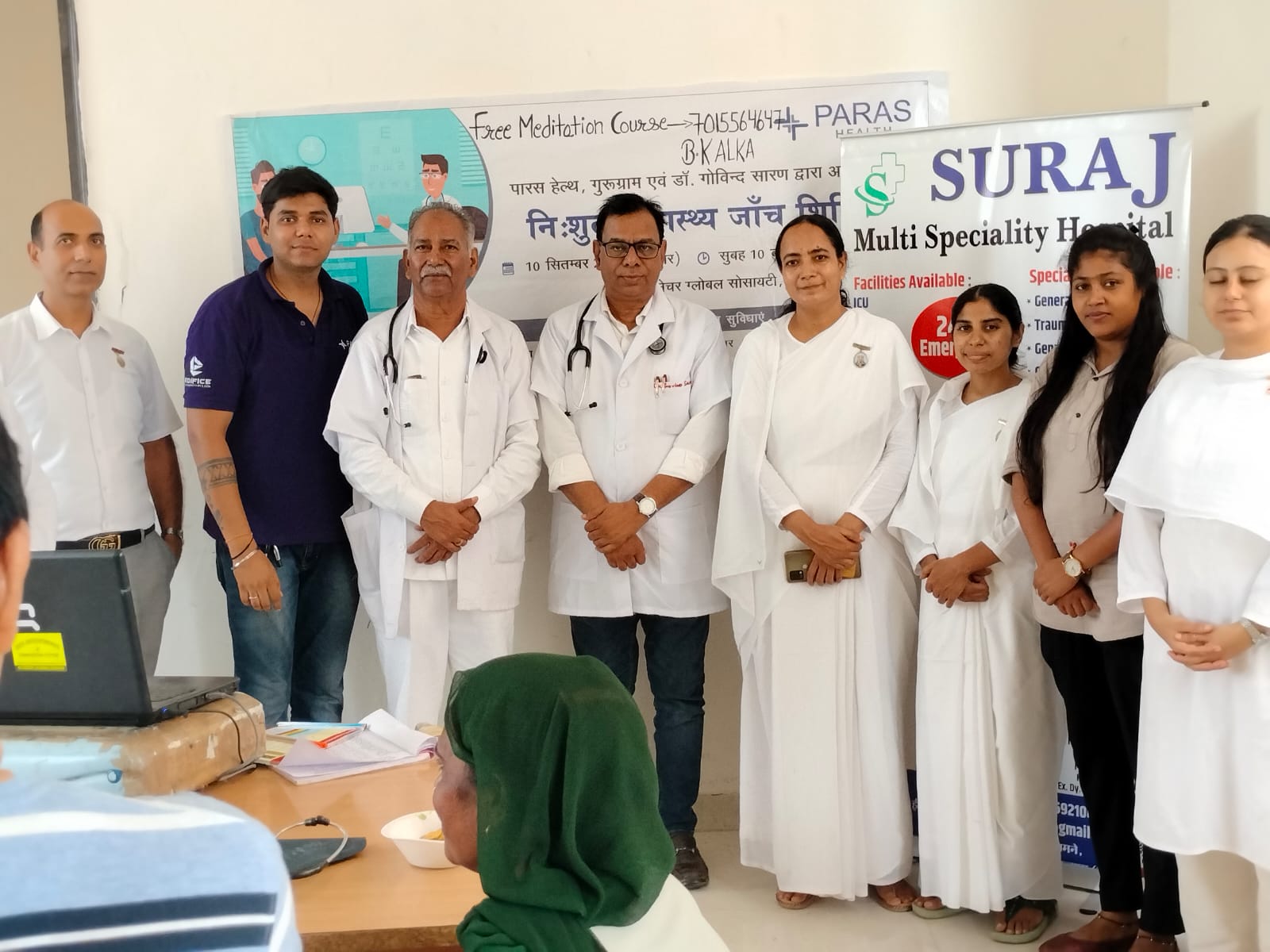 Doctors and volunteers together at a free health and meditation camp