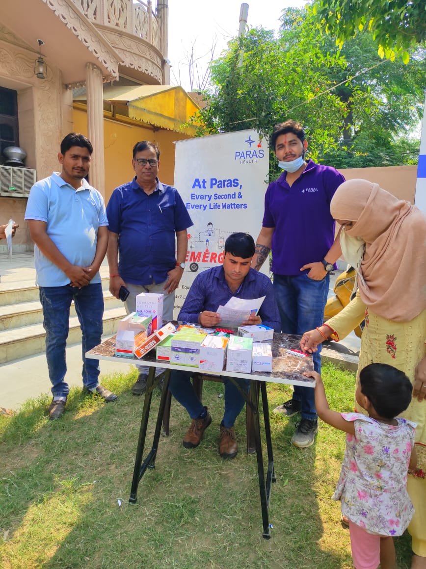 Free medicines being handed out to families at a camp