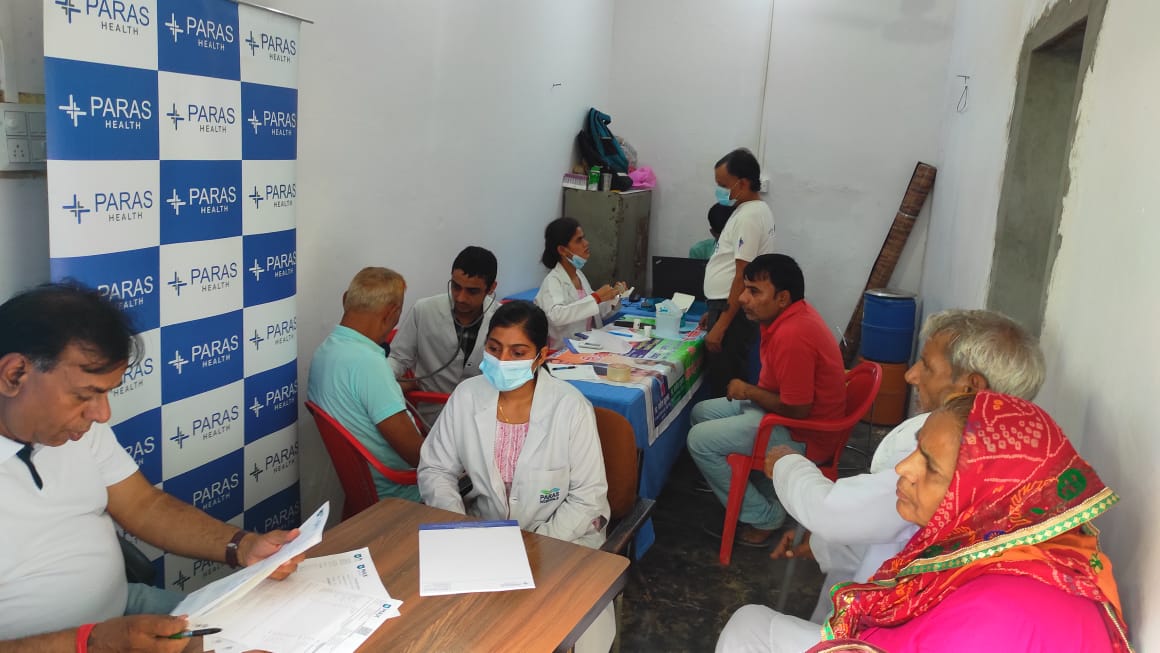 Several screening stations running at once inside a health camp